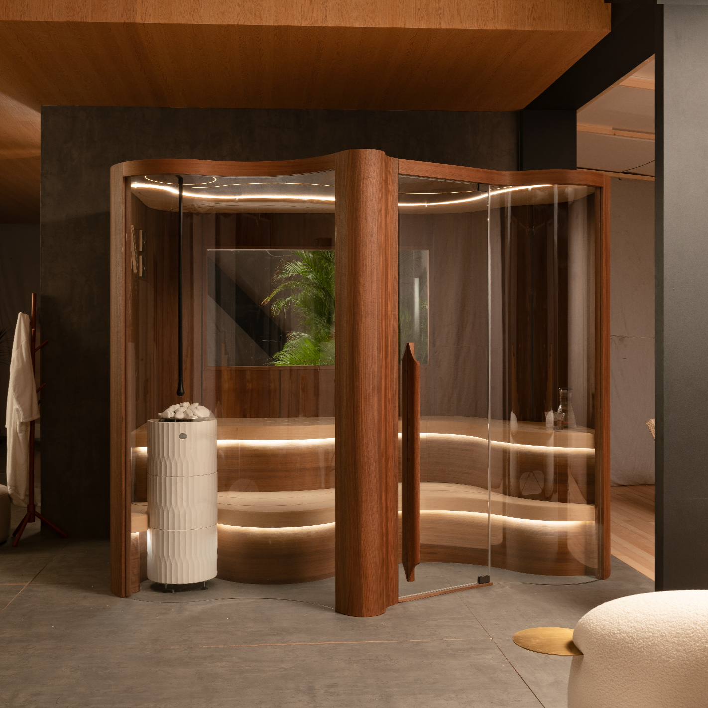 Modern indoor sauna with wooden exterior and glass panels, surrounded by a cozy interior.
