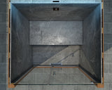 Modern steam room enclosure with dark glass panels on a tiled bathroom floor.