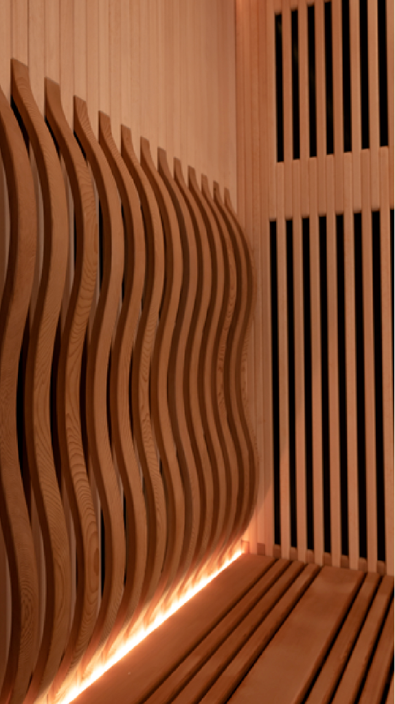 Wooden sauna interior with wavy bench and vertical slats