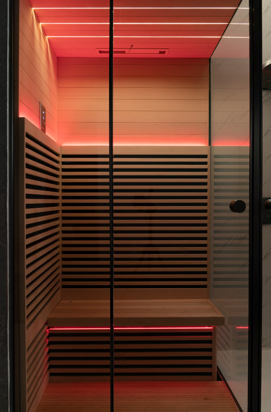 Modern sauna with wooden interior and red LED lights