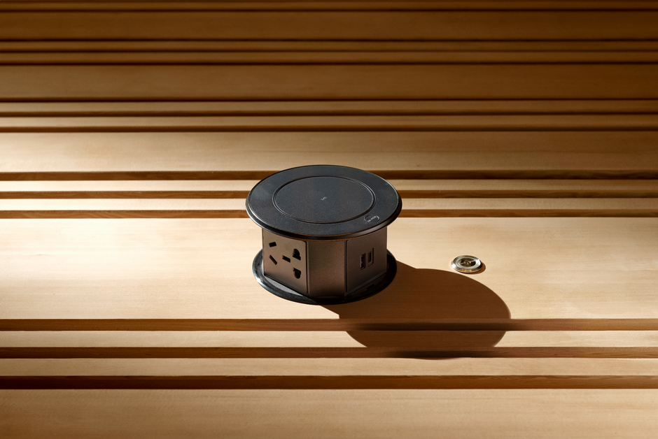 Round metallic object on a wooden surface